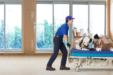 team member removing junk from healthcare facility