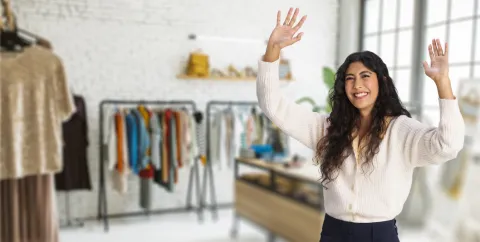 happy retail manager in decluttered retail space